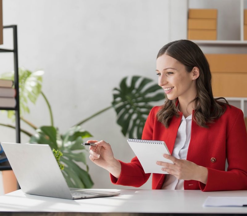 Portrait business woman smile and use tablet checking information on parcel shipping box